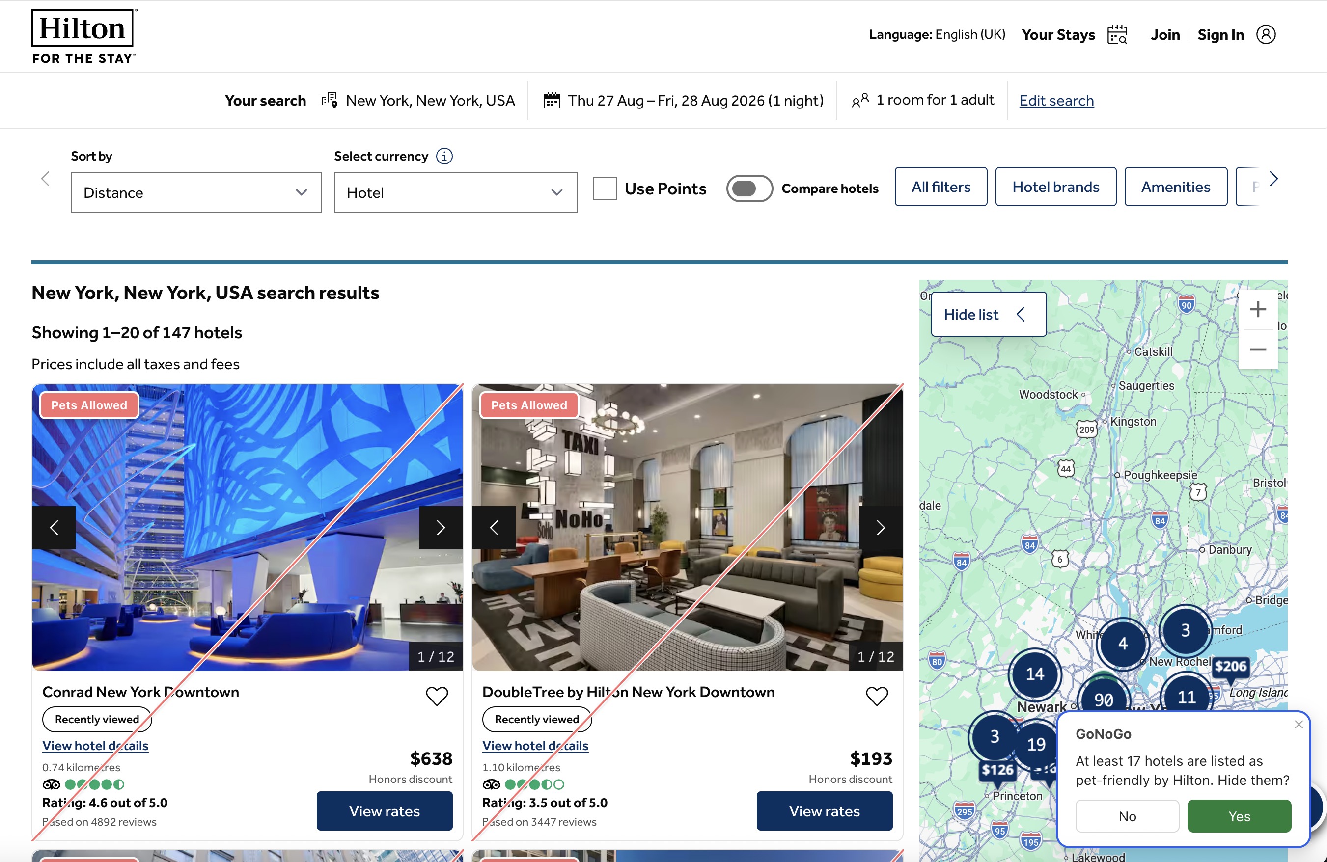 Hilton search results for New York with 'Conrad New York Downtown' and 'DoubleTree by Hilton New York Downtown' carrying red 'Pets Allowed' corner badges, and GoNoGo's check panel